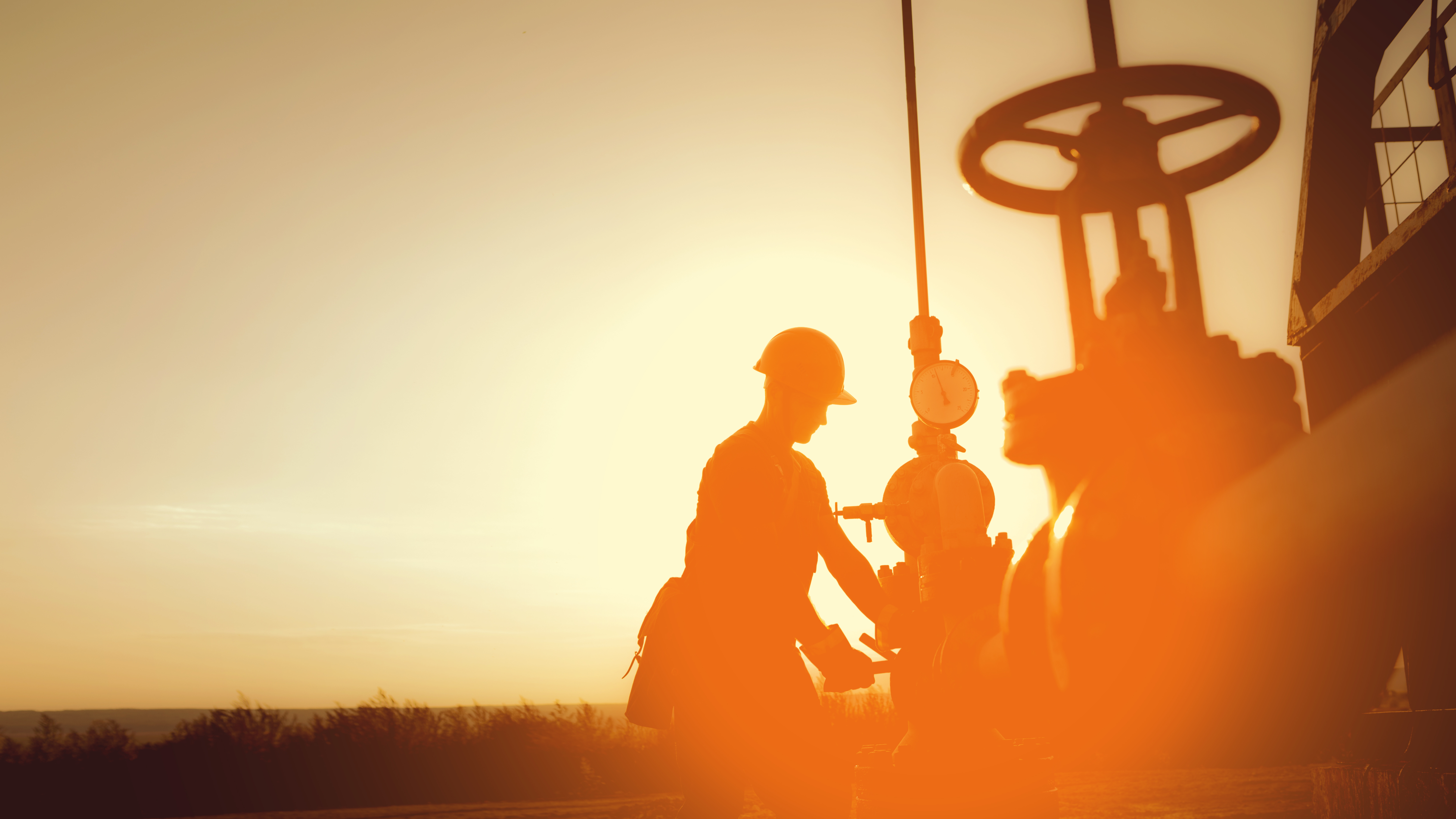 Oil worker checking the oil pump